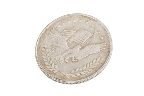 istock old vintage silver dollar isolated on background 916301170