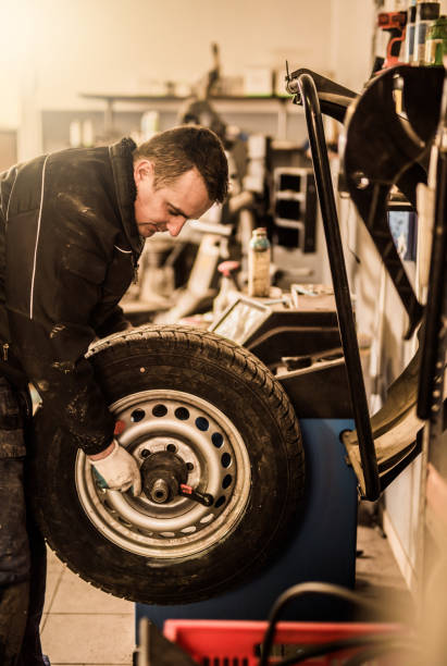 istock Mechanic putting a damaged wheel on a dyno. 916303746