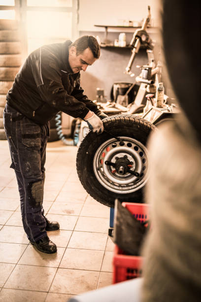 istock Mechanic putting a damaged wheel on a dyno. 916304036