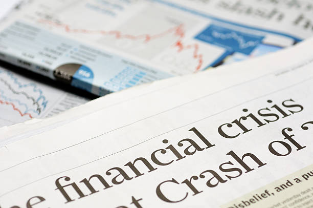 Close up of newspaper headline for financial crisis news Newspaper headlines - financial crisis on 2008 economy crisis stock pictures, royalty-free photos & images