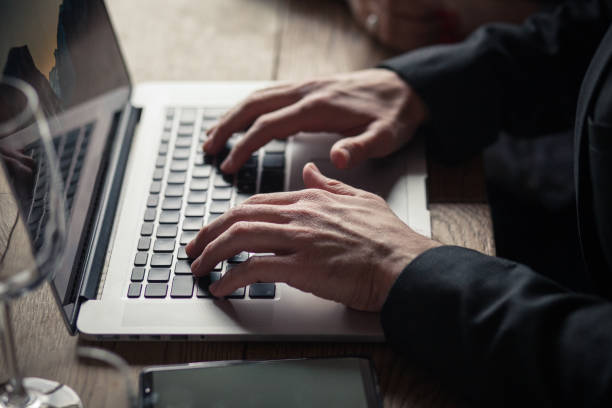 istock Young businessman typing on a laptop 916307338