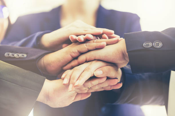 istock Business people teamwork join hands together. Business  success teamwork ideas concept 916314000