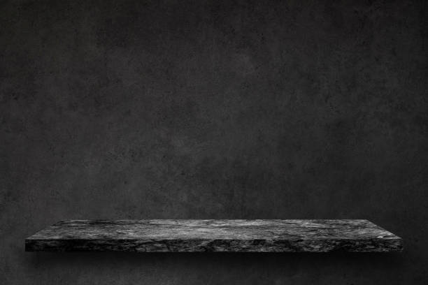 istock Empty top of black marble stone table on concrete wall background texture grunge and grey surface with space or display for add text or image and product. Loft style. 916314444