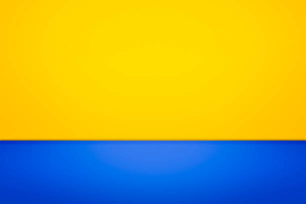 istock Yellow room wall with blue floor texture. 916336552