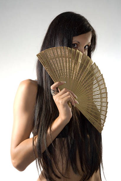 Girl with fan stock photo