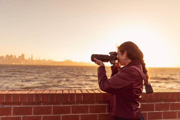 istock Photographer Shooting Landscape Photos 916345974