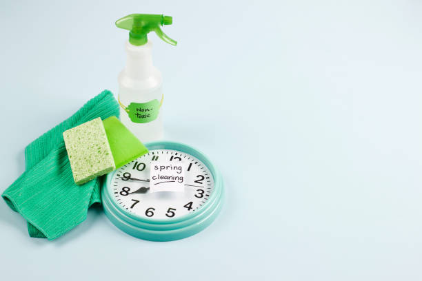 istock spring clean green spray bottle and sponges 916346252