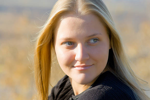 Carefree blond woman outdoors.