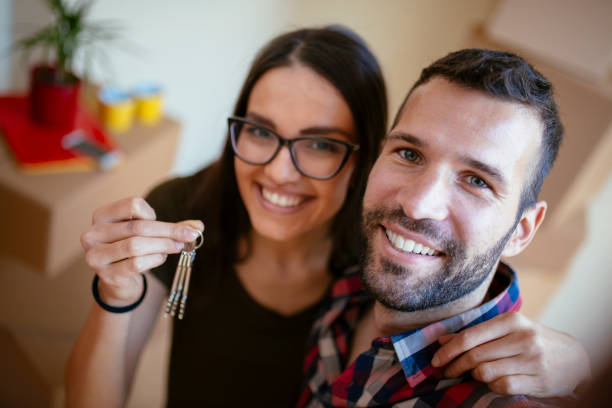 istock Young couple moving in into new apartment 916357148
