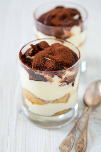 istock tiramisu in glass on wooden surface 916361698