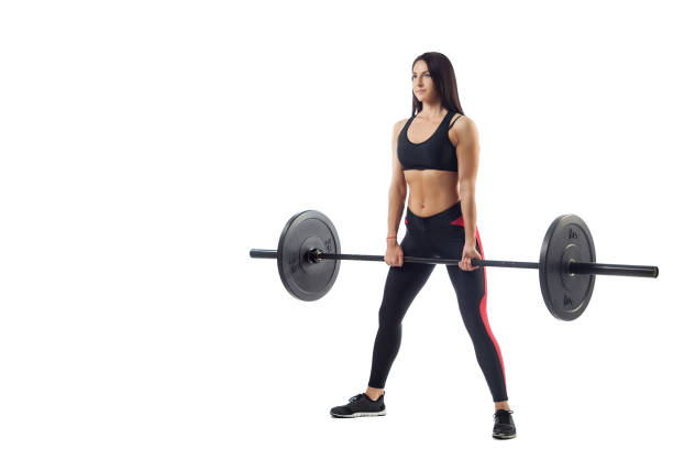 istock woman doing squat with barbell 916362236
