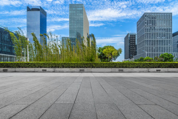 istock Empty pavement front of modern office buildings 916365246