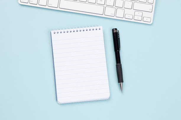 Workspace - Notebook and keyboard stock photo