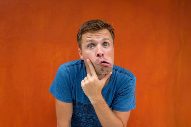 istock Attractive thoughtful young man is confused and unsure. 916369366