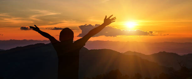 istock Man raised his arms to the mountains 916379352