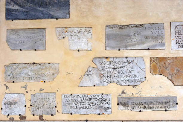 Rome, Italy - January 02: marble plaques with an inscription in Latin on the wall of the Basilica of Santa Maria in Trastevere on January 02, 2017, Rome, Italy