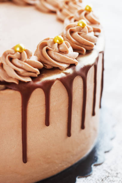 istock Chocolate Cake with Fudge Drizzled Icing and Curls 916389854