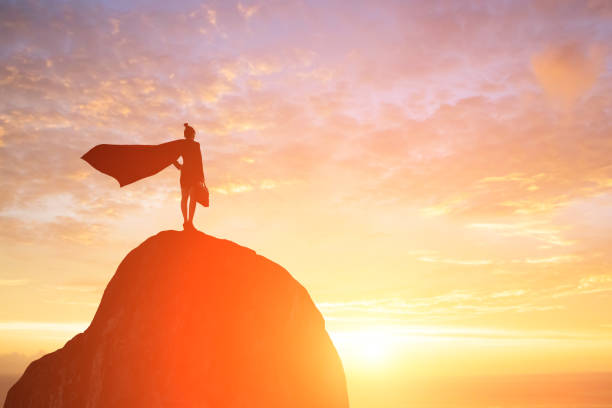 istock super business woman on mountain 916389918