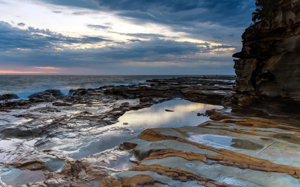 istock Rocky Sunrise Seascape 916393772