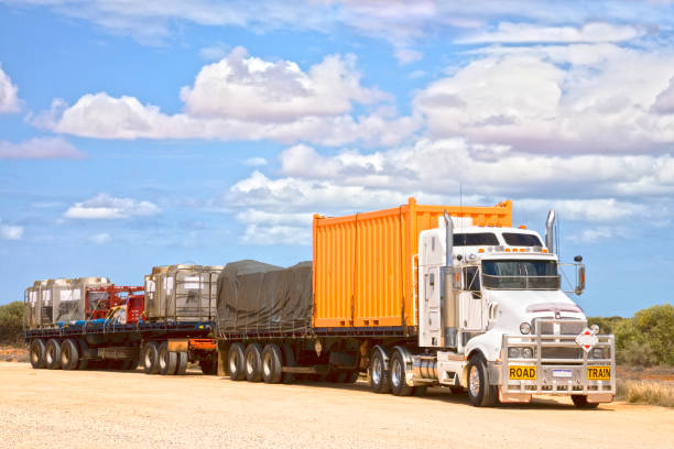 istock Road Train Carrying Shipping Containers 916399234