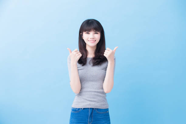 istock young woman student thumb up 916400084
