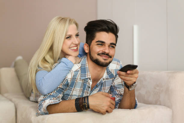 istock Couple watching TV at home 916406548
