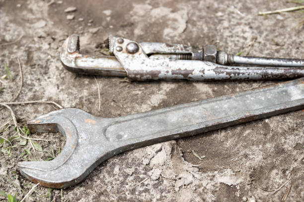 istock Used old rusty adjustable wrench. Adjustable spanners on the background. 916406840