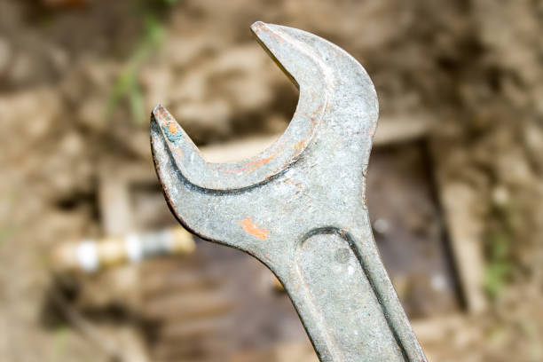 istock Used old rusty adjustable wrench. Adjustable spanners on the background. 916406854