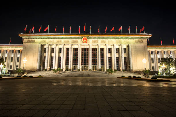 the great hall of the people in the night, located at the east side of tiananmen square - tiananmen square imagens e fotografias de stock