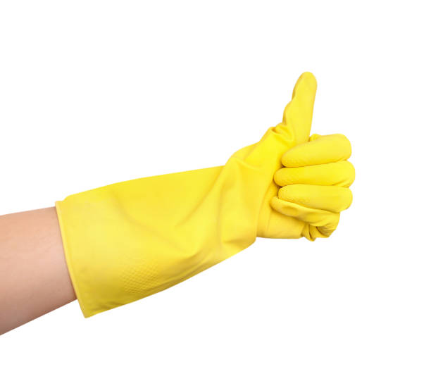 istock Rubber glove over hand isolated. 916408440
