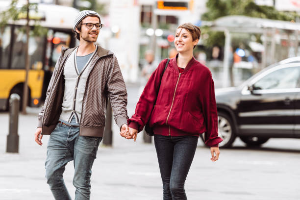 istock hipster couple walking together in berlin 916408478