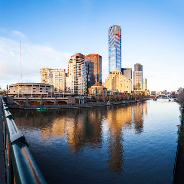 Southbank reflected in the Yarra River in early morning from Princes Bridge, Melbourne, Australia.\