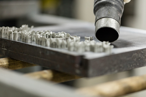 Close-up cleaning teeth after 3D metal powder print out