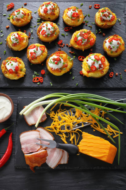 istock tasty loaded potatoes halves, top view 916417926