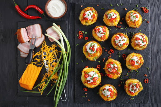 istock baked potatoes loaded with grated cheese 916417958