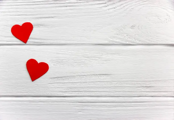 Two Red paper hearts on  Rustic Vintage texture white table background. Flat lay. Top View. Make hand made postcard.