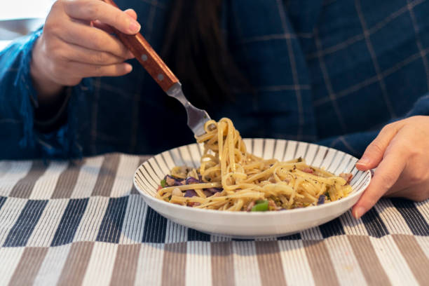 istock eating Pasta: bacon, mushroom and purple cabbage 916418492