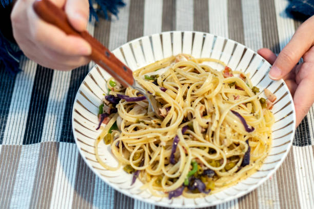 istock eating Pasta, made with bacon, mushroom and purple cabbage 916418516
