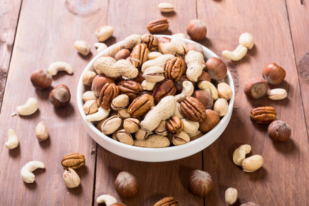 istock Mix of nuts in plate 916421574