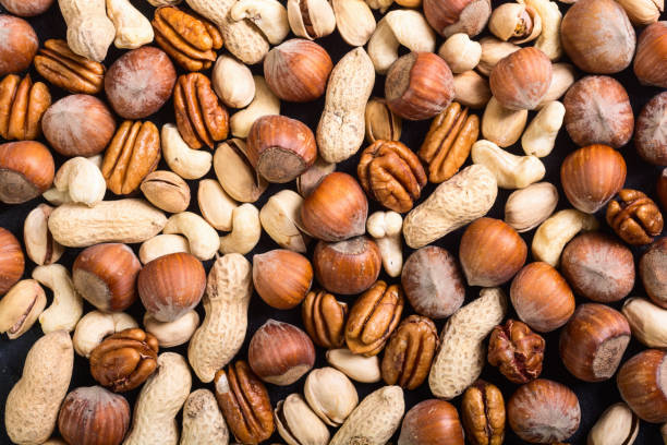 istock Mix of nuts in plate 916421612