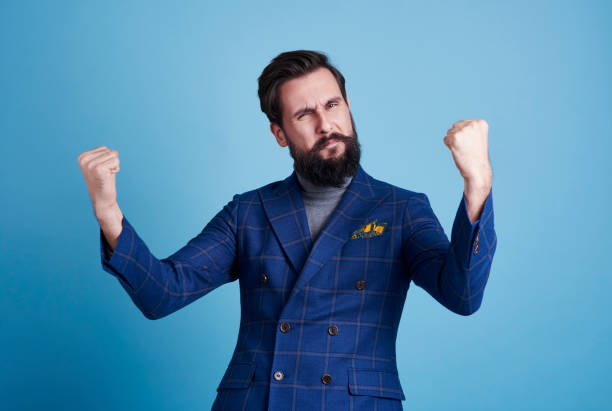 istock Businessman celebrating his success at studio shot 916422068