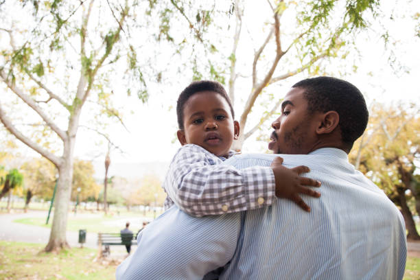 istock Dad holding his beautiful boy in his arms. 916422400