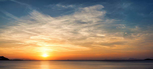 Sunset with clouds at the sea