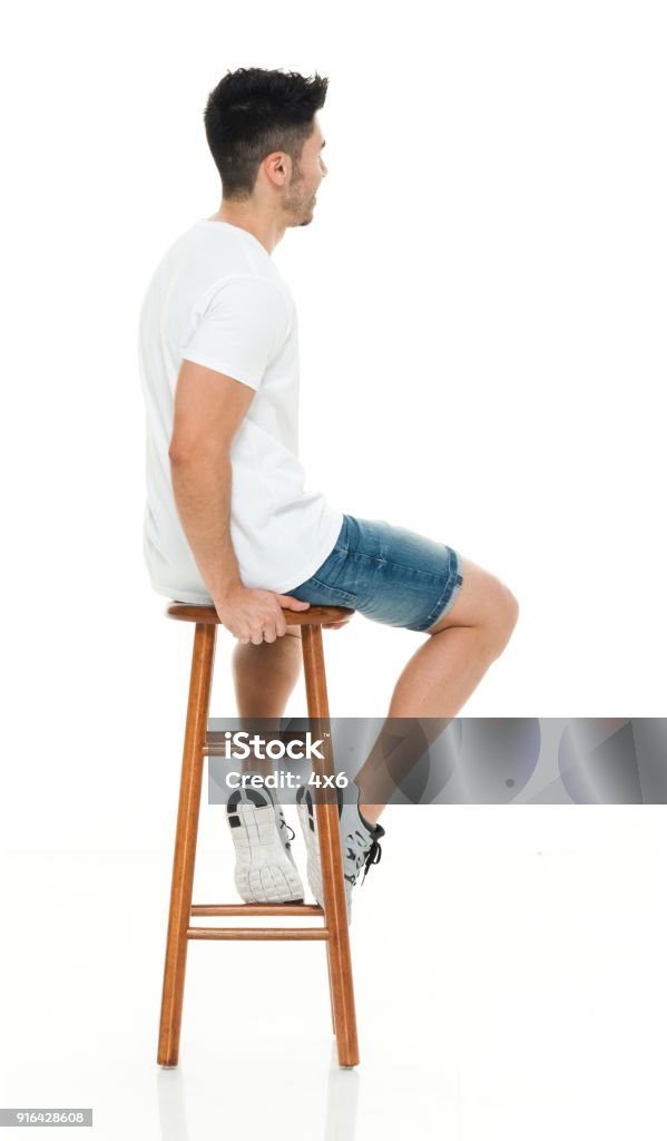 Man Seated On Stool Stock Photo Download Image Now Rear View