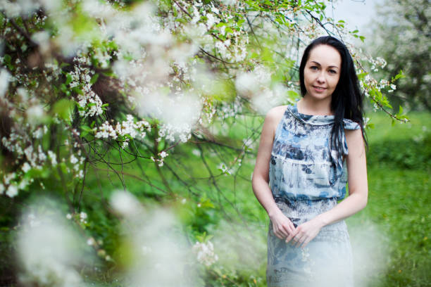 istock Young woman portrait in spring park 916428714