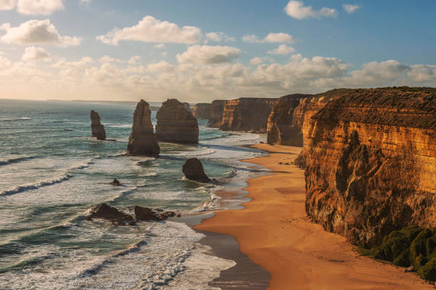 Sunset over The Twelve Apostles  in Victoria, Australia Sunset over The Twelve Apostles along the famous Great Ocean Road in Victoria, Australia, near Port Campbell. Artistic vintage style processing. great ocean road photos stock pictures, royalty-free photos & images