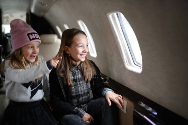 istock Girls in the airplane 916436800