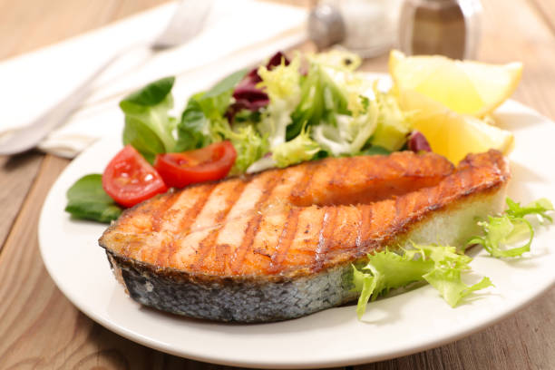 istock salmon steak and salad 916437636