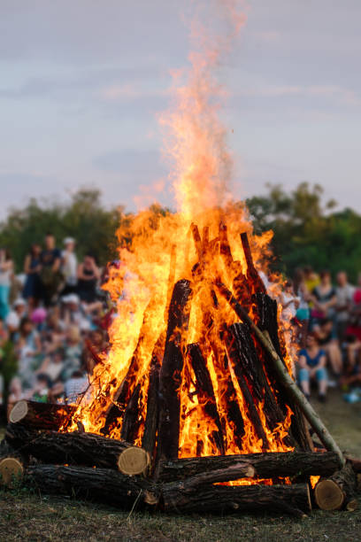 istock Unrecognizable people watch as huge bonfire burns 916442590