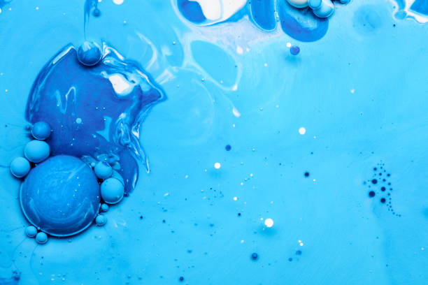 Abstract background from blue acrylic paints and oil